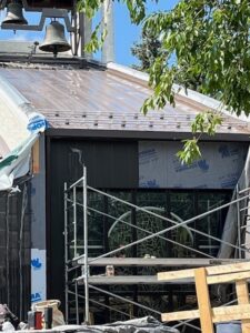 Metal seams taped and sealed on both sides from the bell tower and down