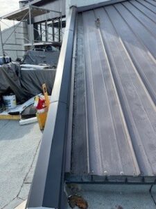 Seams resealed next to S.E. stained glass