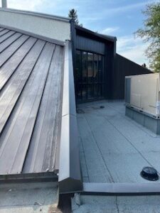 Completed roof and new metal clad N.E. stained glass window